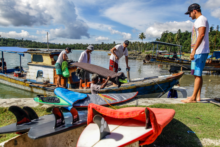 Loading surfboards for a trip to a remote surf spot in Simeulue island, Indonesia.